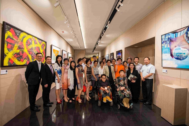 Group photo of artists with disabilities and guests in Congress Plus.